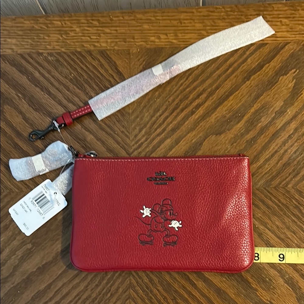 Coach Red Wristlet with Mickey on skates.  NWT